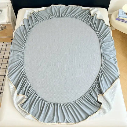 Light gray bear jacquard cooling mat with ruffled edges textured center and mesh side panels for bedroom mattress pad