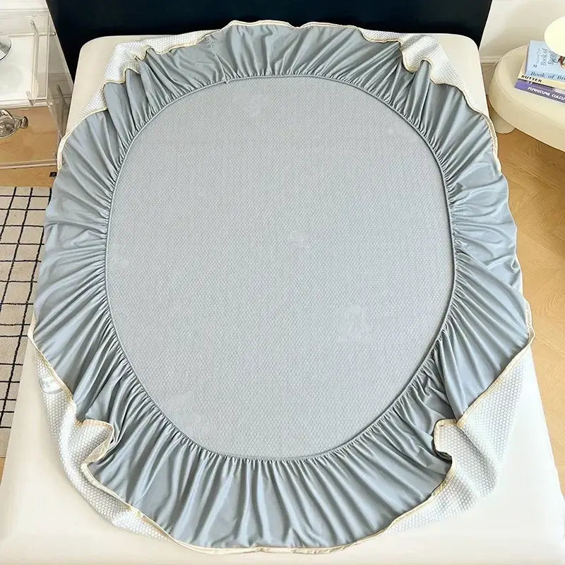 Light gray bear jacquard cooling mat with ruffled edges textured center and mesh side panels for bedroom mattress pad