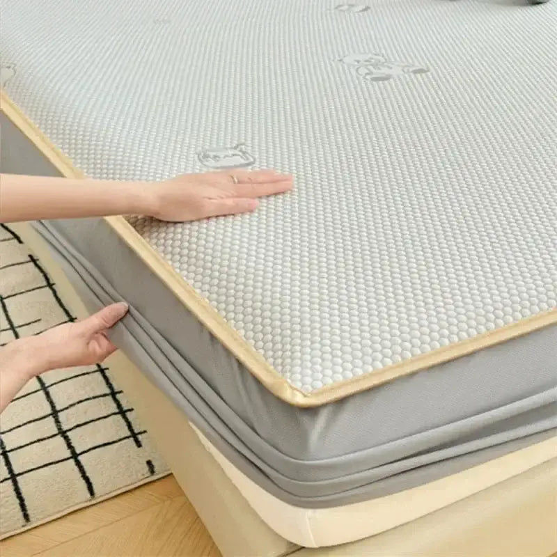Light gray jacquard cooling mat with beige border and subtle bear prints for bedroom use