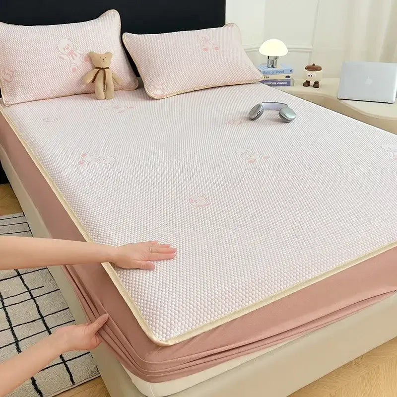 Pink textured cooling mat with subtle embroidered bear patterns for little bear gray jacquard cooling mat bedroom use