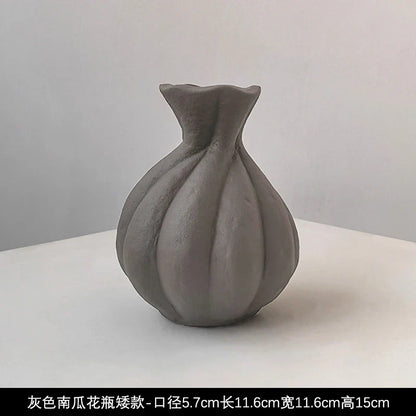 A matte gray Livetai wabi-sabi handmade ceramic vase with a bulbous segmented body and flared neck for modern boho decor