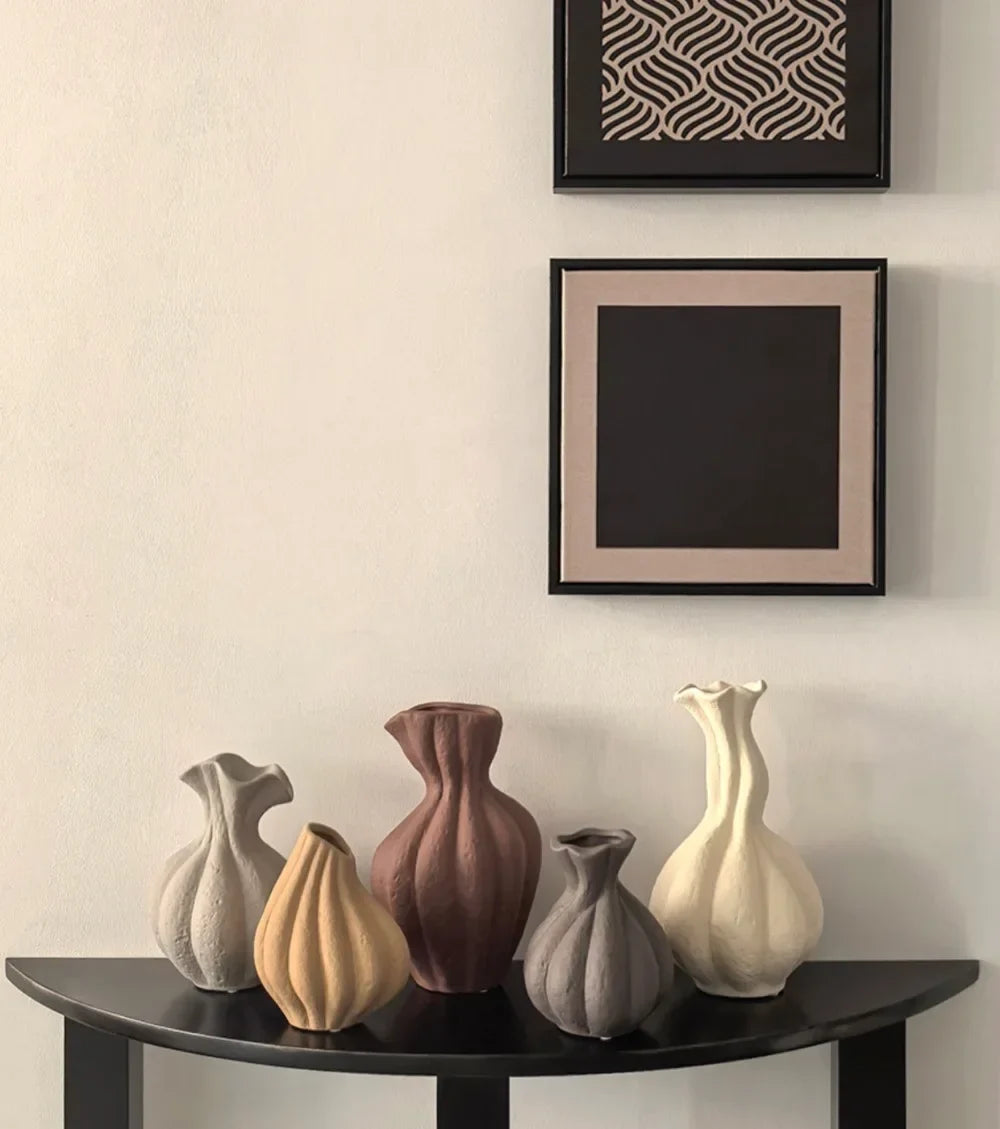 A set of six livetai wabi-sabi handmade ceramic vases in muted earth tones with organic shapes for modern boho decor