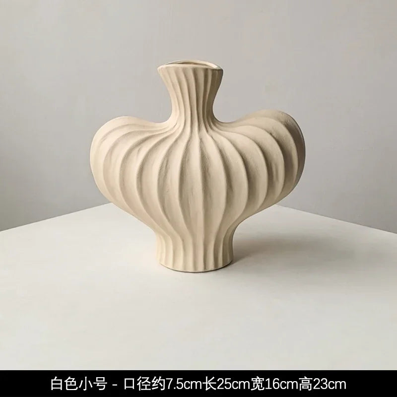 Cream-colored livetai wabi-sabi ceramic vase with ribbed organic shape and dual-sided flared neck for modern boho decor
