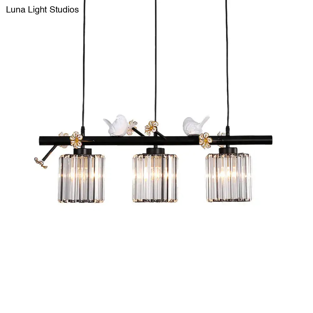 DecorBites black island pendant light with clear crystal cylinder shades and white ceramic birds on floral accents