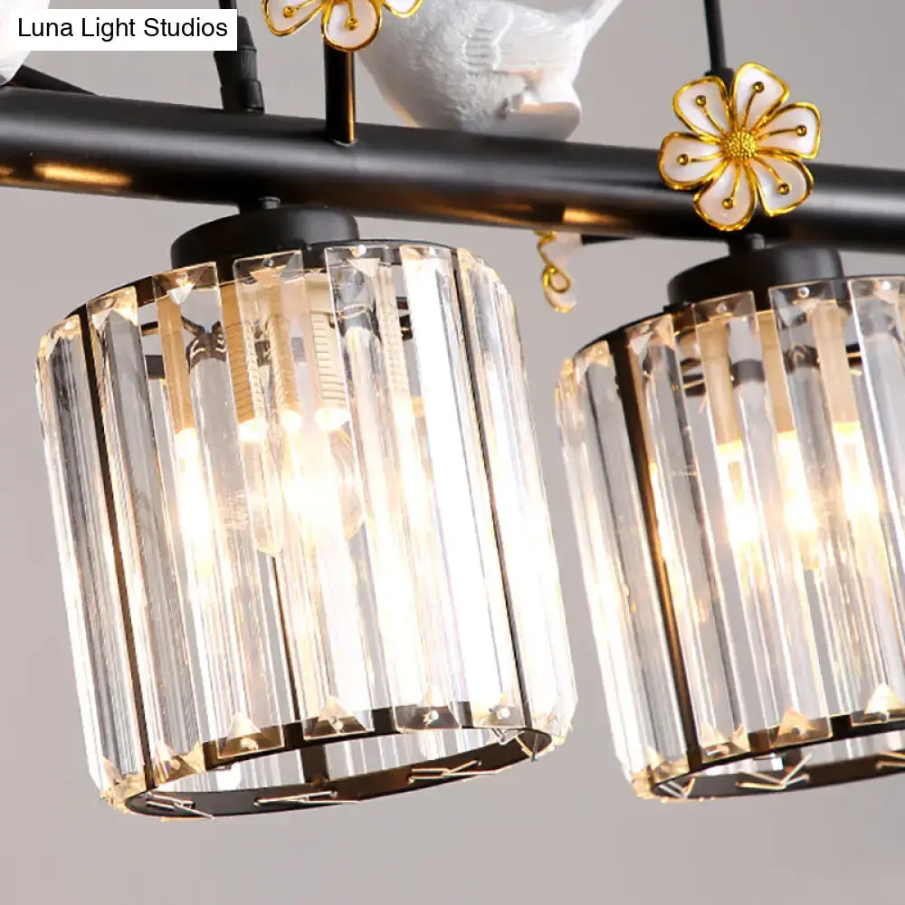 Decorbites black island pendant light with clear crystal cylinder prisms gold floral accents and bird design