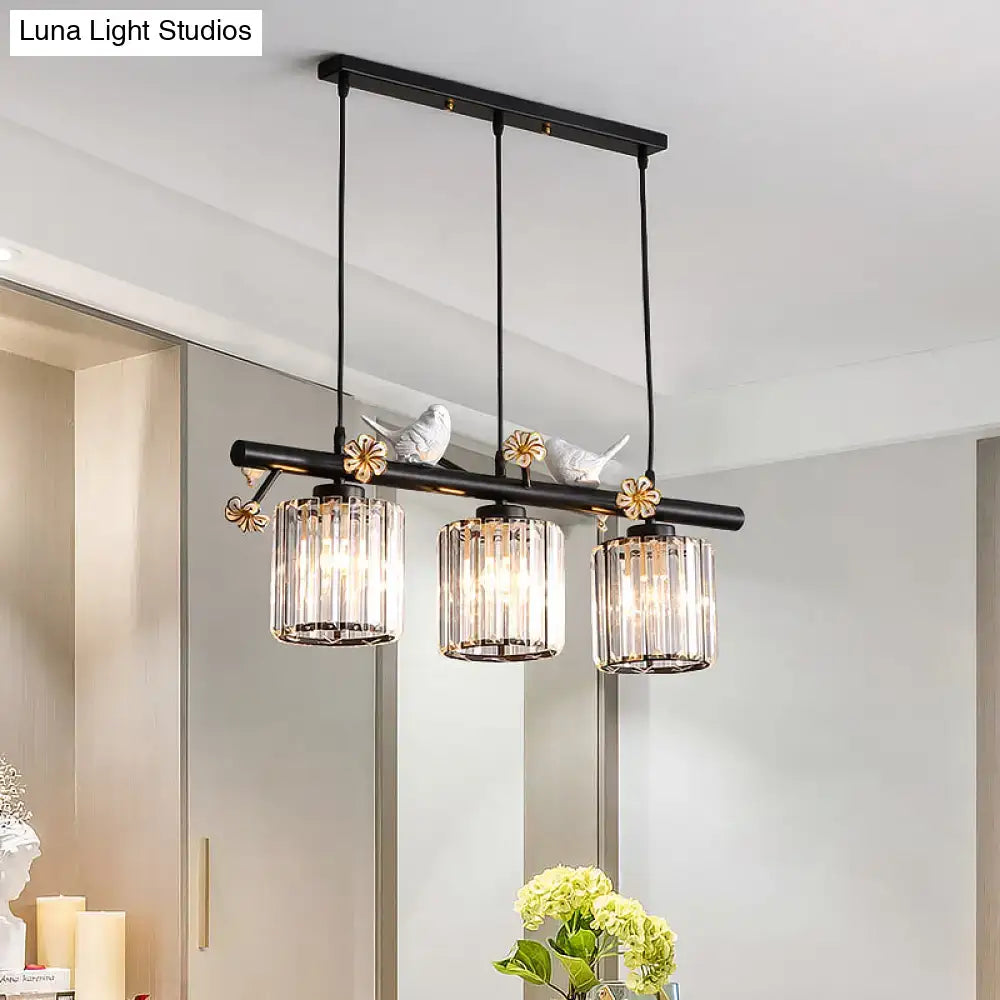 DecorBites black island pendant light with three clear crystal cylinder shades and decorative bird and flower accents