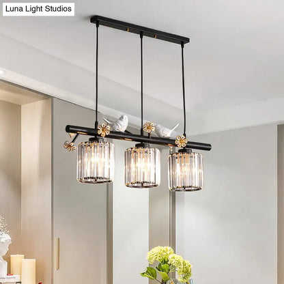 DecorBites black island pendant light with three clear crystal cylinder shades and decorative bird and flower accents