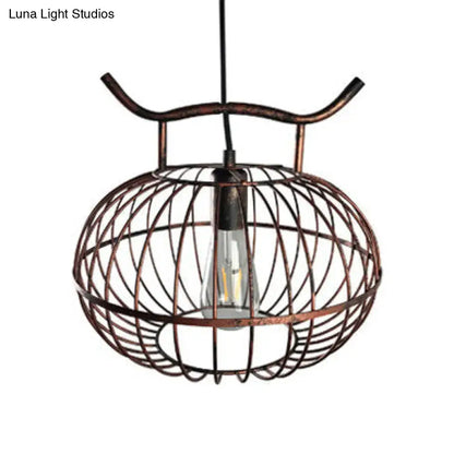 Decorbites™ lodge style metal pendant light with copper-toned wire cage and exposed edison bulb in rust aged brass lantern design