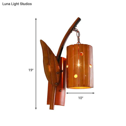 Copper-toned metal wall lamp with leaf-shaped bracket and cylindrical shade featuring vertical slats for 220v-240v use