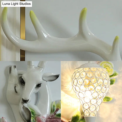 DecorBites™ Loft Style Wall Mounted Sconce with Clear Crystal Shade, Blue/Gold Finish and Deer Head Accent