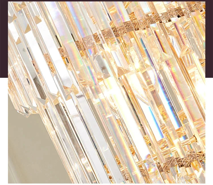 A luxurious long crystal staircase gold chandelier with cascading clear prisms for hotel hall and villa decor