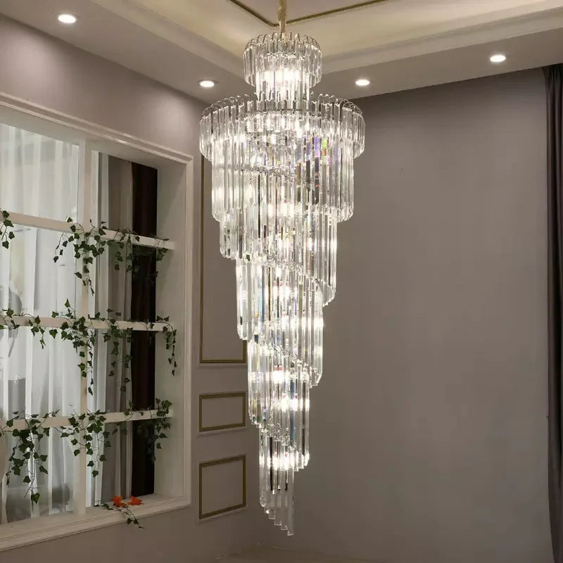 A multi-tiered long crystal staircase gold chandelier with clear glass rods and embedded lights for hotel hall decor