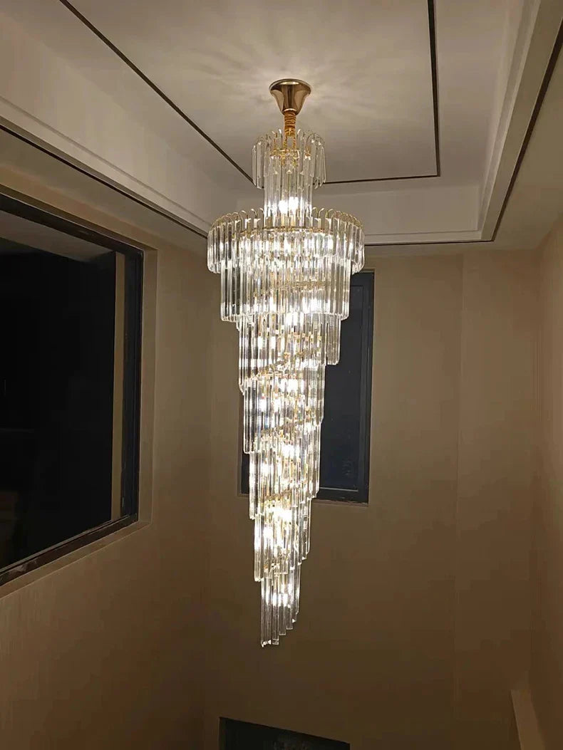 A long crystal staircase gold chandelier with cascading clear glass rods for luxury hotel hall and living room decor