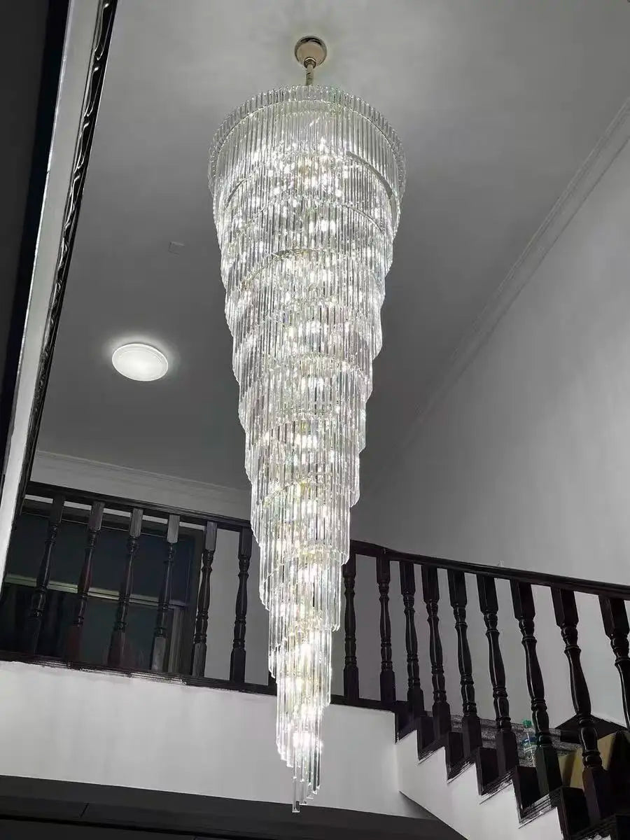 A long crystal staircase gold chandelier with tiered faceted glass rods for hotel hall and luxury villa decor