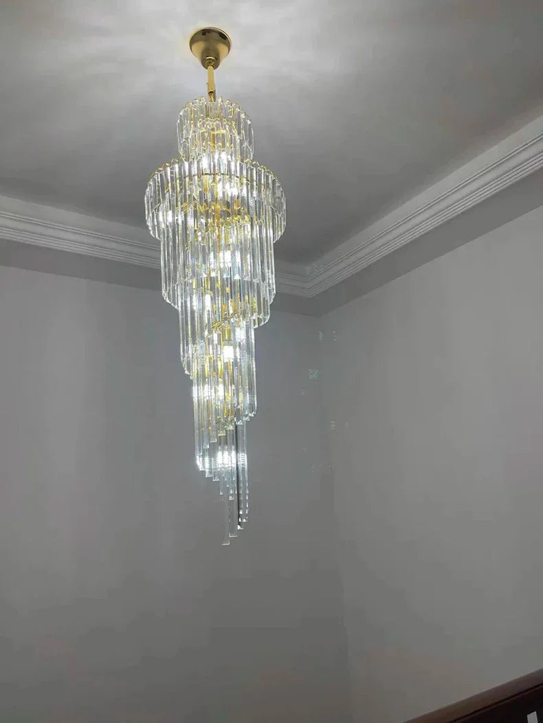 A multi-tiered long crystal staircase gold chandelier with cascading clear glass rods for hotel hall or luxury villa decor