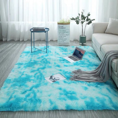 Blue and white tie-dye rug with fluffy texture, likely made of polyester or polypropylene.