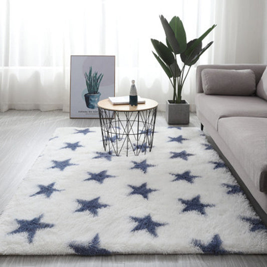 White star rug with blue stars, plush material, modern design.
