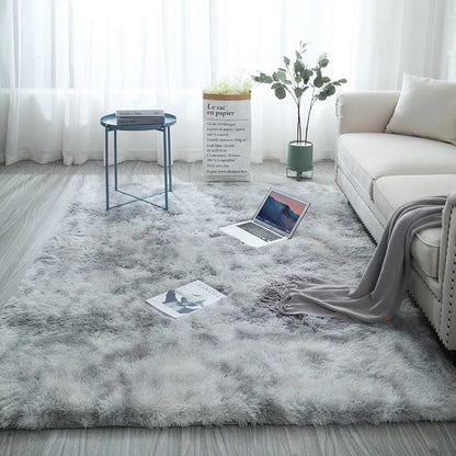 Gray fluffy rug with a textured pattern and soft appearance.