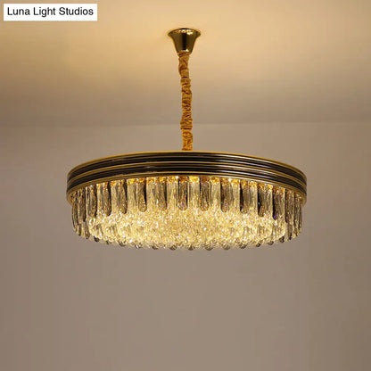 Lámpara de techo Loop para salón: elegante diseño de bloques de cristal con 14 bombillas en acabado dorado.