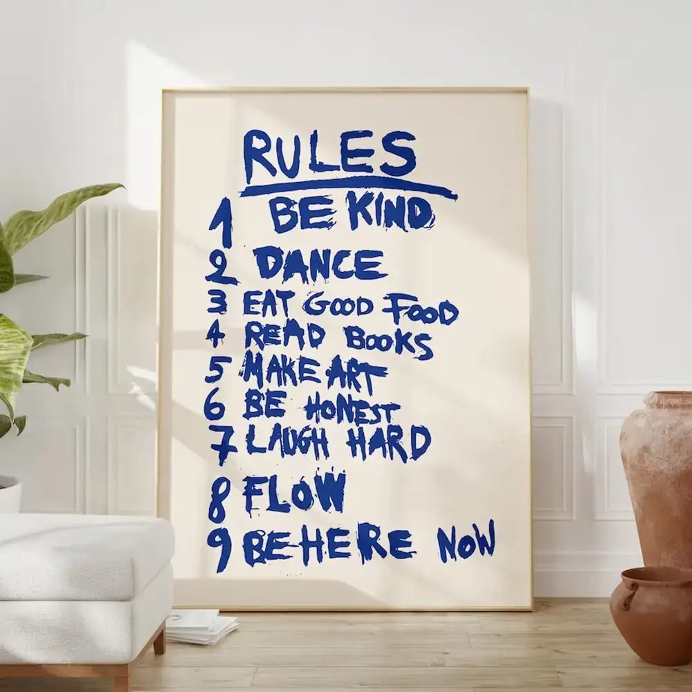 A framed decorbites wall art canvas with bold blue handwritten rules love quote on cream background for inspiration