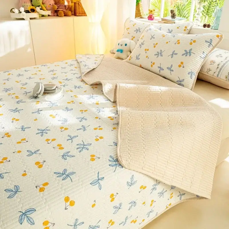 Cream-colored quilted cotton mattress mat with blue dragonflies and yellow cherries in decorbites cartoon pattern