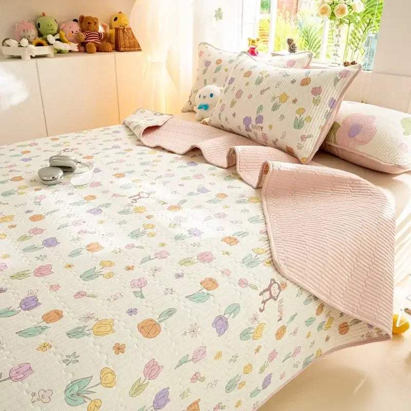 Pastel floral quilted mattress mat with soft pink ruffled edges featuring colorful tulip decorbites cartoon pattern cotton