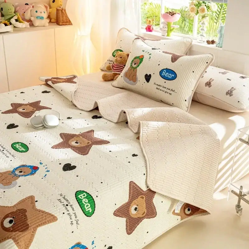 Cream-colored quilted mattress mat with embroidered brown bear faces and decorbites cartoon pattern cotton bedding