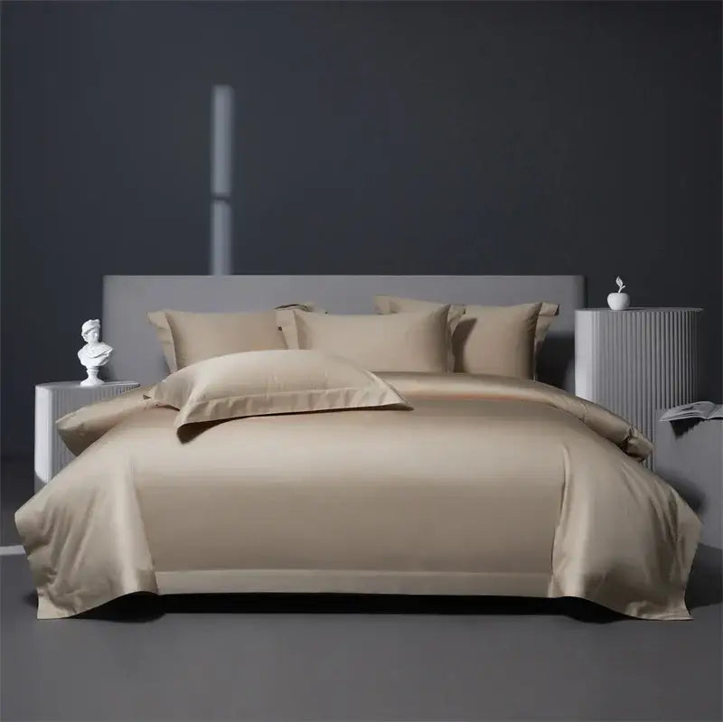 Beige satin duvet cover set with matching pillowcases elegantly draped over a bed in a burgundy red egyptian cotton bedding set