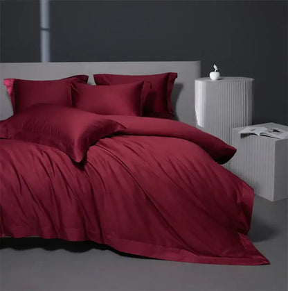 Deep red satin egyptian cotton bedding set with matching pillows and duvet in burgundy red for bedroom use