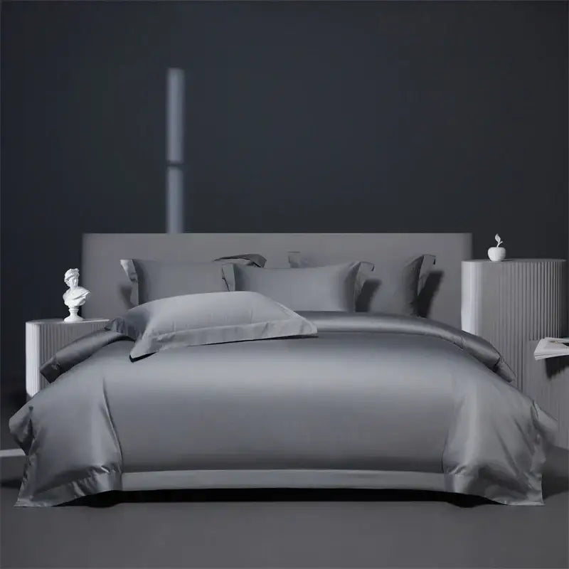 Gray satin bedding set with matching pillows and modern headboard contrasts with luxe burgundy red egyptian cotton bedding set