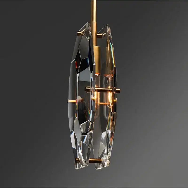 A luxe faceted gold crystal glass pendant lamp with sleek design and exposed bulb for kitchen or bedroom decorbites crystal glass