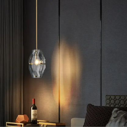 Luxe faceted gold crystal glass pendant lamp with geometric metal frame emitting warm light for kitchen bedroom decorbites crystal glass pendant