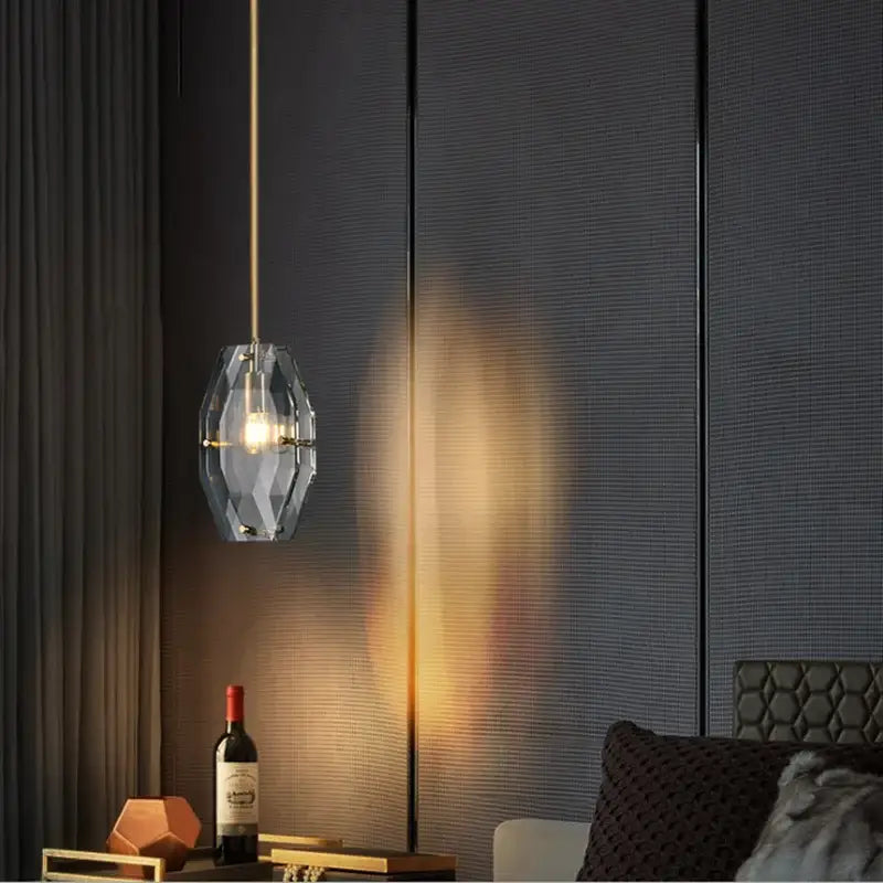 Luxe faceted gold crystal glass pendant lamp with geometric metal frame emitting warm light for kitchen bedroom decorbites crystal glass pendant