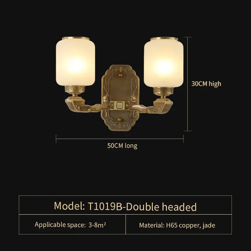 Antique brass double-headed wall sconce with frosted glass shades complements decorbites jade chandelier living space