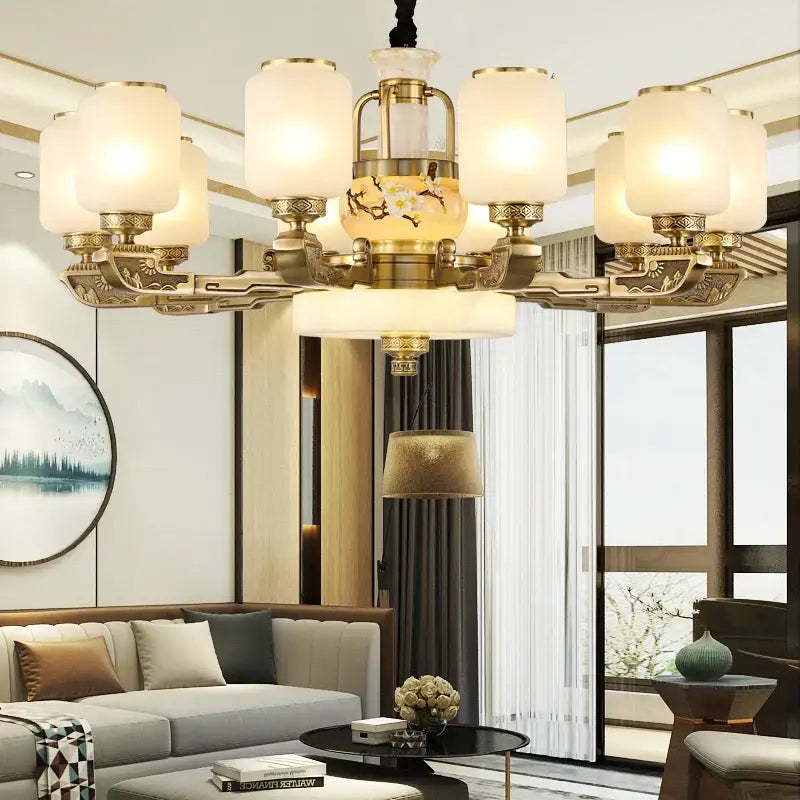 Luxe gold and frosted glass decorbites jade chandelier with brass tones and floral vase for elegant living space lighting