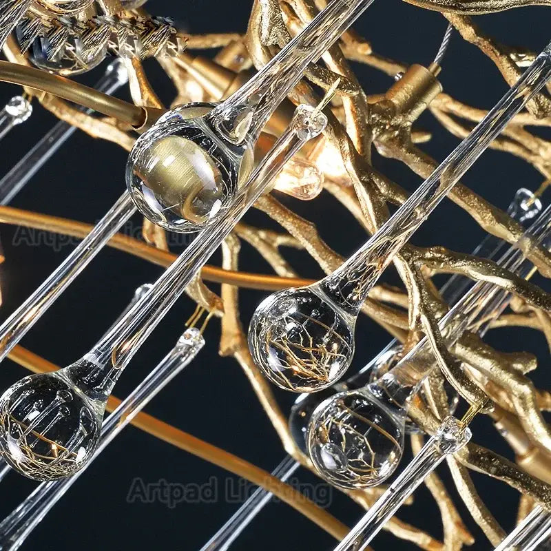 Elegant gold branch crystal led chandelier featuring clear glass teardrop pendants and intricate metalwork for living room