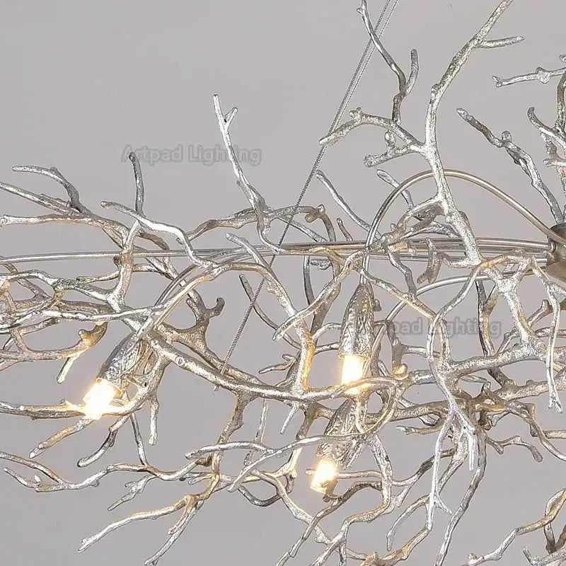 Luxe silver branch crystal led chandelier with intricate tree-like metal arms and warm glowing bulbs for living room
