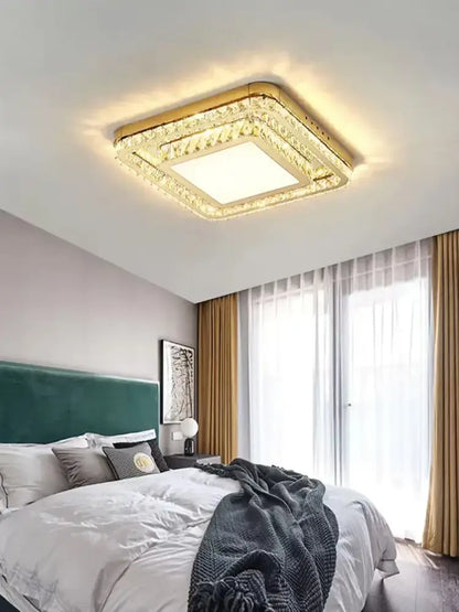 Luxe gold crystal led ceiling chandelier with gold frame and crystal accents providing warm glowing decorbites crystal led illumination