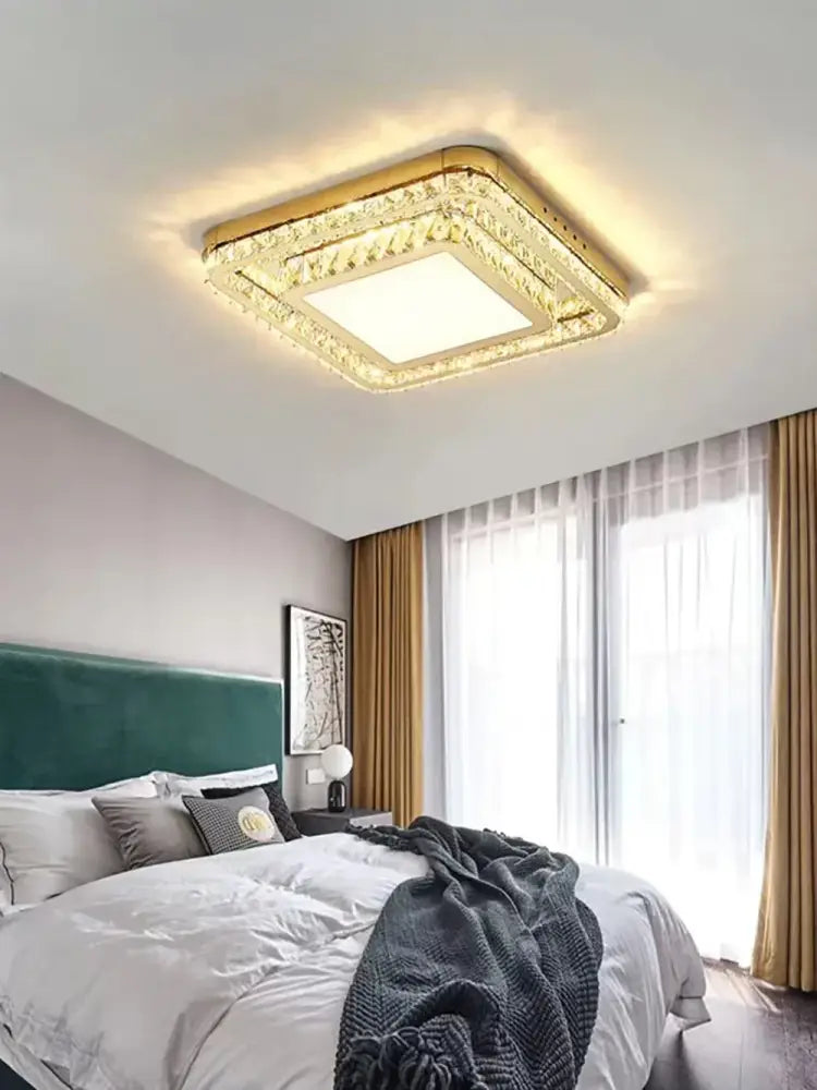 Luxe gold crystal led ceiling chandelier with gold frame and crystal accents providing warm glowing decorbites crystal led illumination