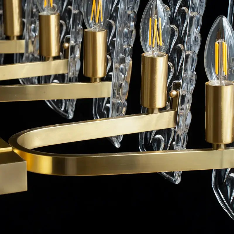 Luxe gold glass led ceiling chandelier with clear leaf-shaped glass shades and exposed filament bulbs for living room