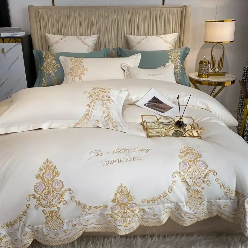 White satin bedding set with gold and lavender floral embroidery scalloped edge luxe in paris script decorbites 1000tc egyptian