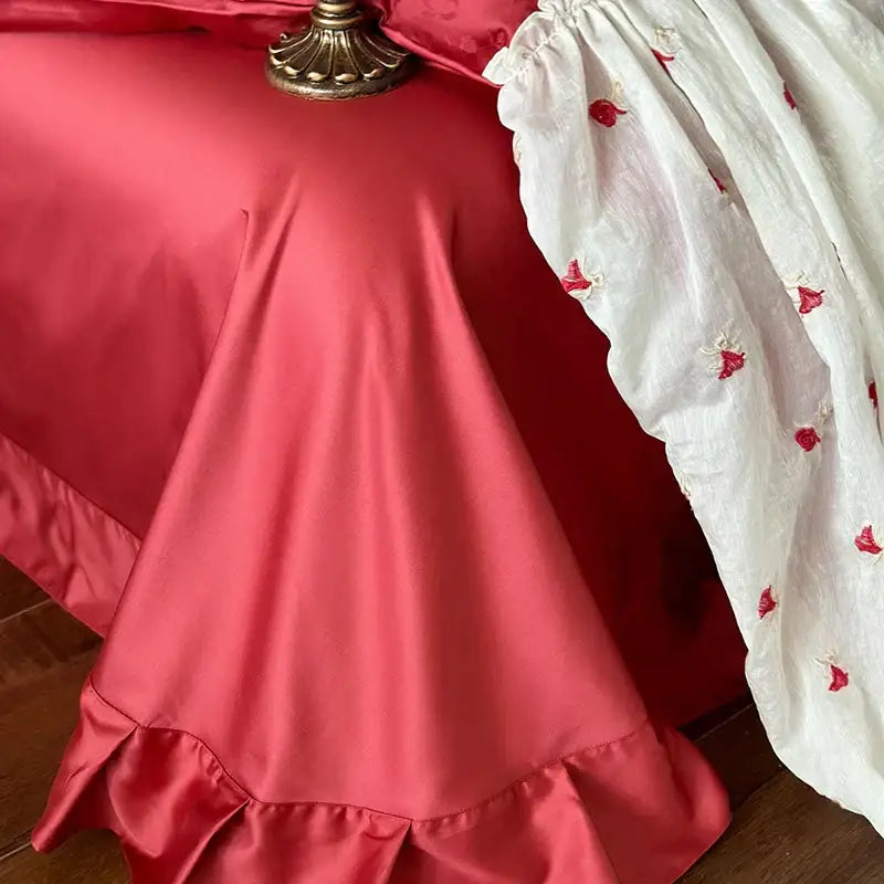 Luxe red and white egyptian cotton lace bedding set with coral satin bed skirt and delicate lace ruffles accents