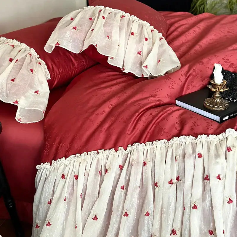 White ruffled bed skirt with delicate red floral embroidery in luxe red and white Egyptian cotton lace bedding set