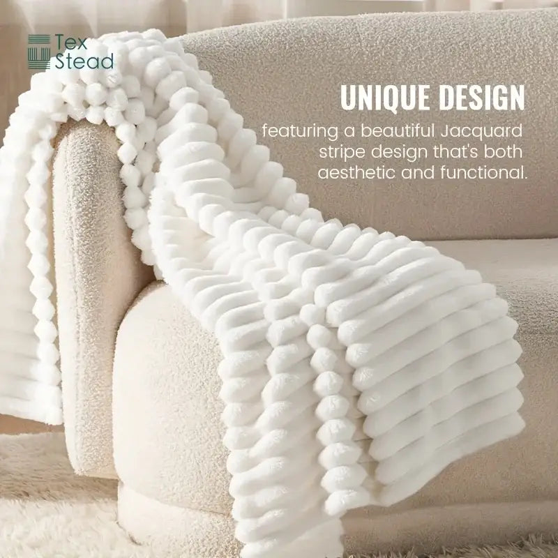 Luxe ribbed white flannel throw blanket with textured jacquard stripe pattern for plush bedroom decor
