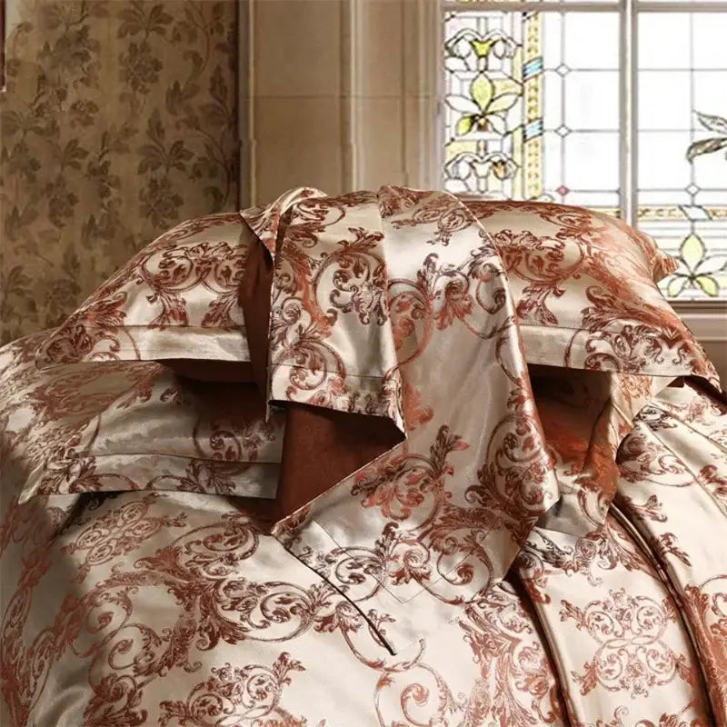 Elegant cream and rust-colored decorbites jacquard satin bedding set with intricate baroque-style floral patterns for luxury decor