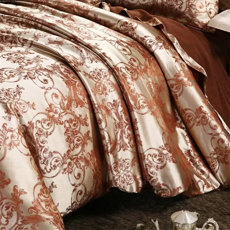Luxurious cream and bronze jacquard satin bedding set featuring a cream-colored satin duvet cover with rust-brown damask patterns