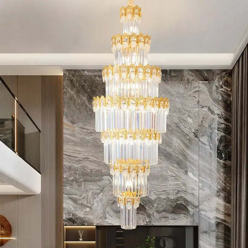 Luxurious gold and clear decorbites crystal staircase chandelier with multi-tiered clear crystal rods and ornate frames