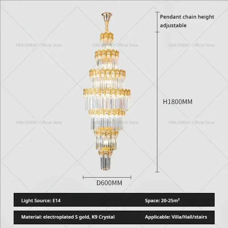 A tall multi-tiered decorbites crystal staircase chandelier with gold electroplated accents and clear k9 crystals