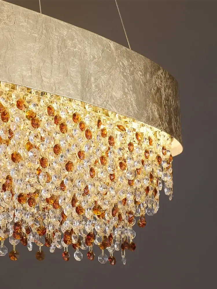 Luxurious gold circular crystal chandelier pendant with textured metallic shade and cascading amber and clear beads for decorbites circular crystal decor