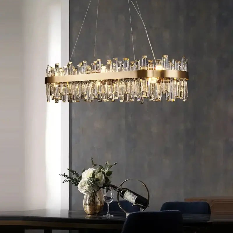 Luxurious gold-toned oval crystal led chandelier with cascading clear rods and embedded lights for living and dining room